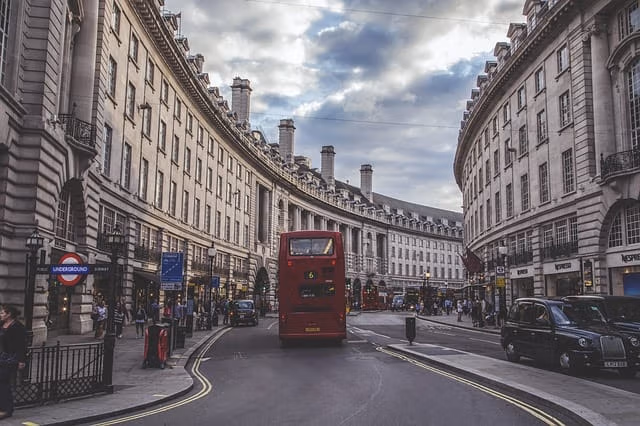 Curved stone residential buildings along a London street