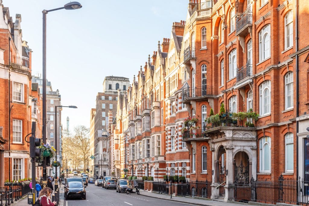 London street lined with red-brick period buildings